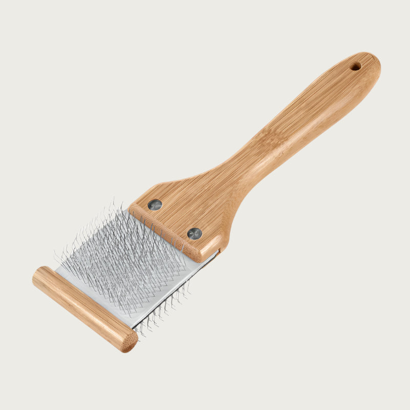 Pet slicker brush with bamboo handle, and gray pad with tightly spaced, thin, angled metal pins. Size S.