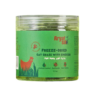 3.5 oz clear plastic container of Arya! Sit Freeze-Dried Cat Grass with Chicken for Dogs & Cats. Hairball control, gut health, low calorie. Product inside is visible; they are small green cubes.