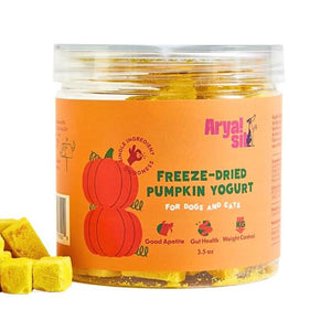 3.5 oz clear plastic container of Arya! Sit Freeze-Dried Pumpkin Yogurt for Dogs & Cats. Good appetite, gut health, weight control. Product inside is visible; they are small pale orange cubes.