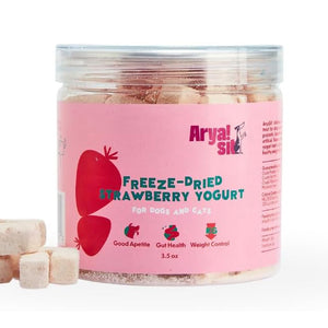 3.5 oz clear plastic container of Arya! Sit Freeze-Dried Strawberry Yogurt for Dogs & Cats. Good appetite, gut health, weight control. Product inside is visible; they are small pale pink cubes.