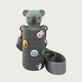 Load image into Gallery viewer, Alternate view of the Bestie Bottle Sling in Smoke, with a green koala Bestie Bottle inside.
