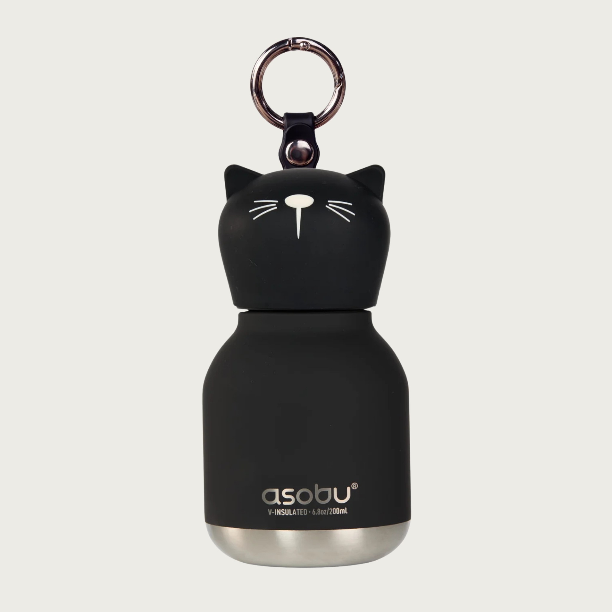 A black cat-shaped insulated water bottle with a silver metal base and silver keychain ring on top, featuring the 'asobu' brand logo on the lower front. The cap is the cat's head, with small pointy ears, and minimal white-line nose & whisker details.
