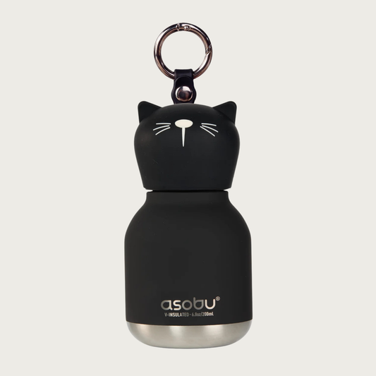 A black cat-shaped insulated water bottle with a silver metal base and silver keychain ring on top, featuring the 'asobu' brand logo on the lower front. The cap is the cat's head, with small pointy ears, and minimal white-line nose & whisker details.