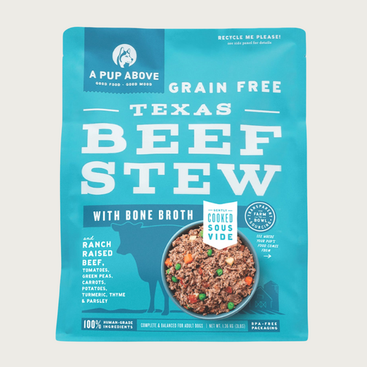 3 lb blue bag of A Pup Above Texas Beef Stew recipe dog food. Gently cooked sous vide. Bag has a small photo of a bowl of the food, that looks like ground beef with chopped bits of potatoes, carrots and green peas.