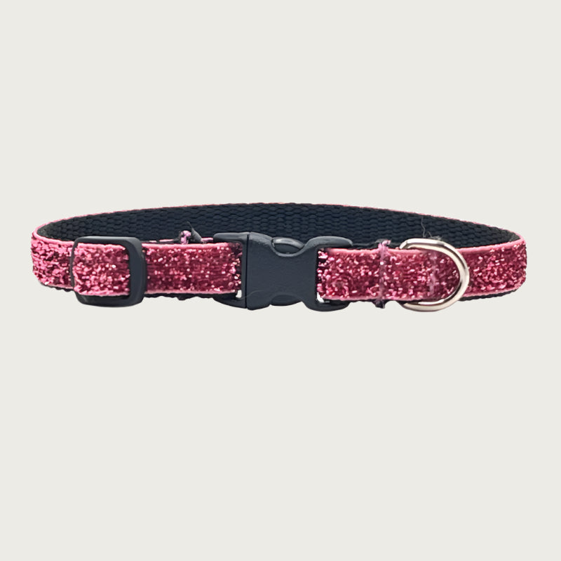 Skinny, rosy pink hued glitter teacup dog collar with a small D-ring, black nylon inner webbing and black plastic buckle. The fabric itself is shimmery & glittery - it is not glued on.