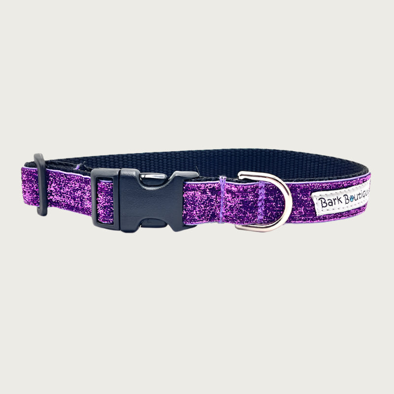 Deep purple hued glitter 3/4" wide dog collar with a D-ring, black nylon inner webbing and black plastic buckle. The fabric itself is shimmery & glittery - it is not glued on.