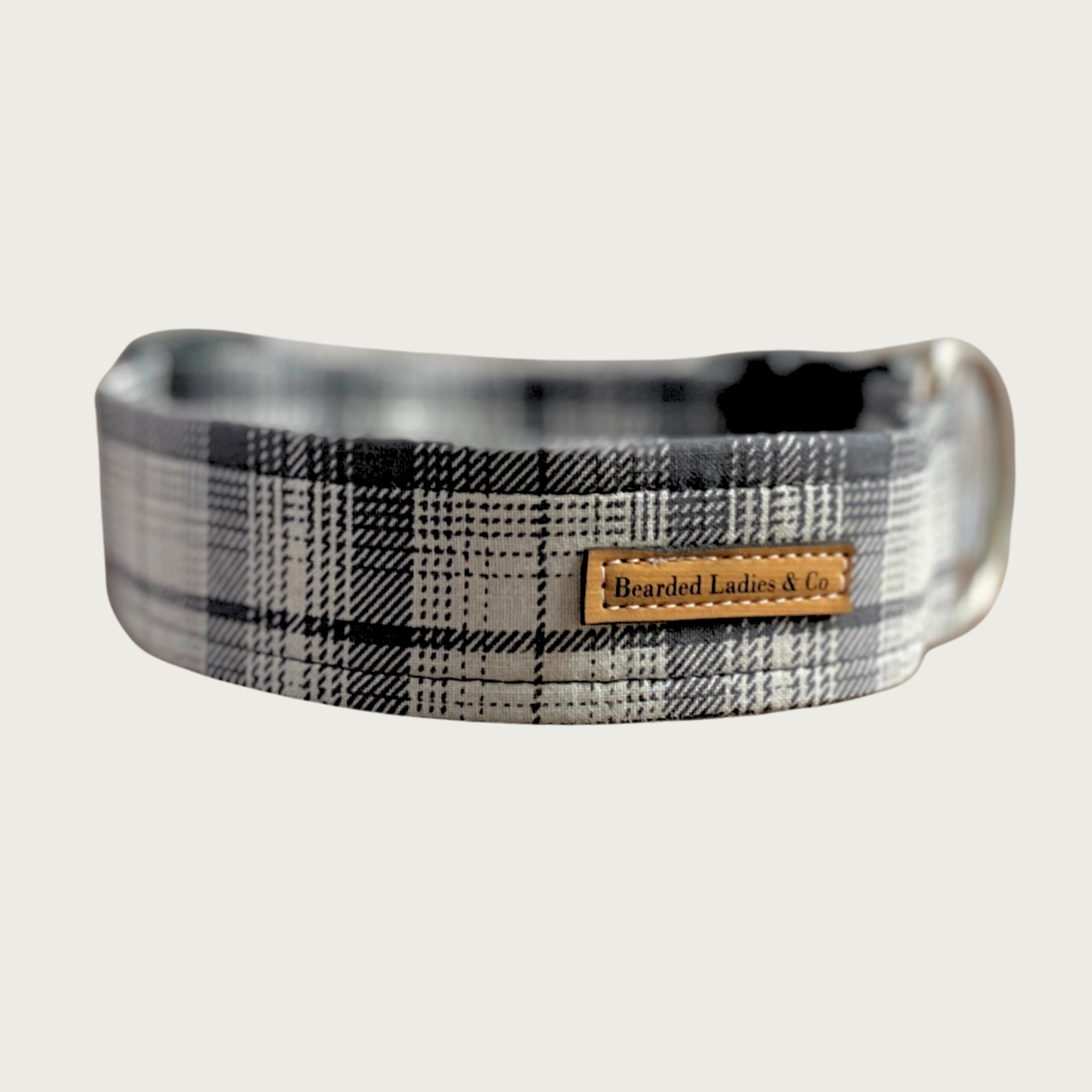 Plaid-patterned dog collar in shades of medium gray and cream.