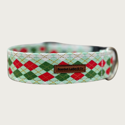 Christmas themed dog collar with dark green, mint green, red, and white argyle pattern.