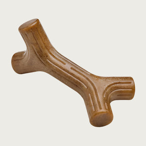 Brown, barbell-shaped, hard chew toy. Ends are Y-shaped instead of round, and there are shallow ridges of various lengths along the whole toy.