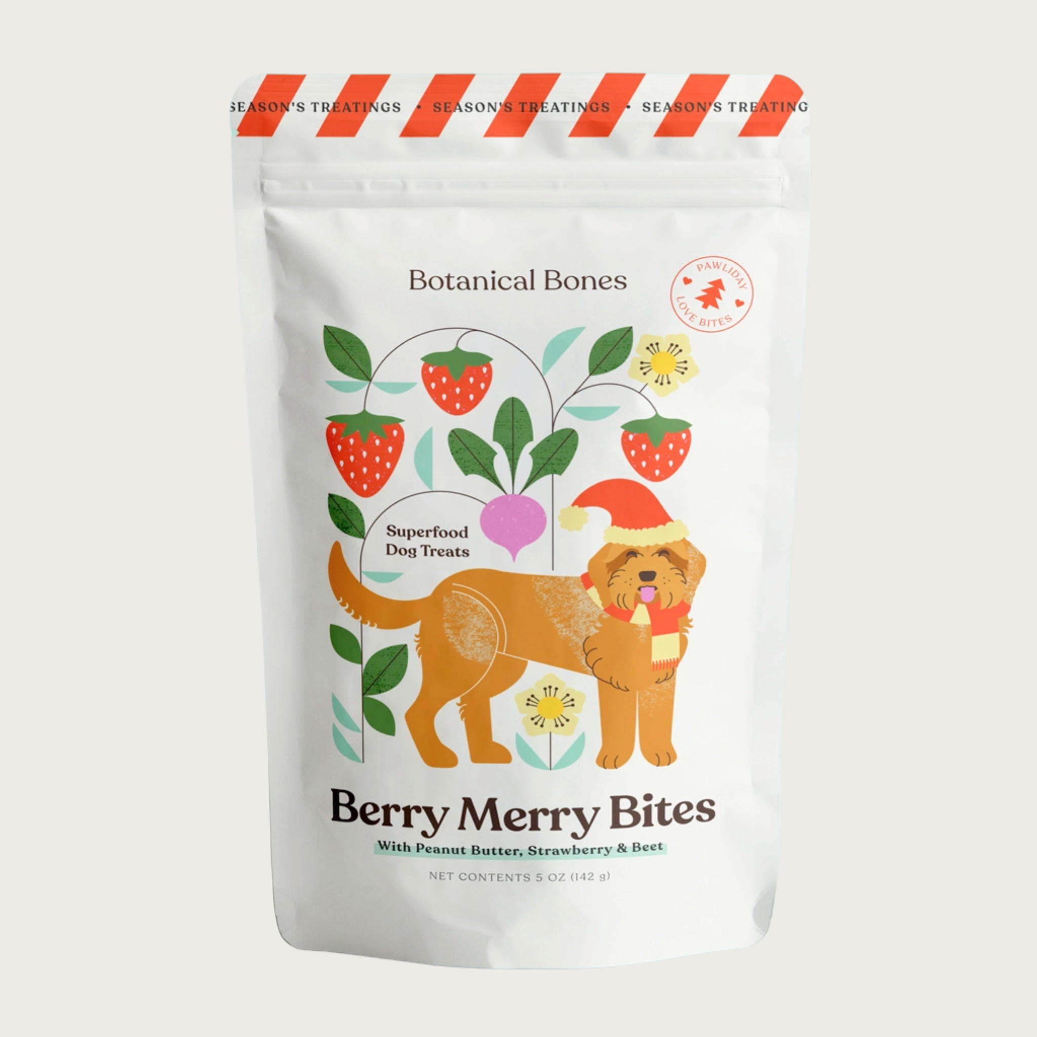 Bag of Botanical Bones Berry Merry Bites superfood dog treats with peanut butter, strawberry & beet. Packaging features an illustrated dog and botanical design.