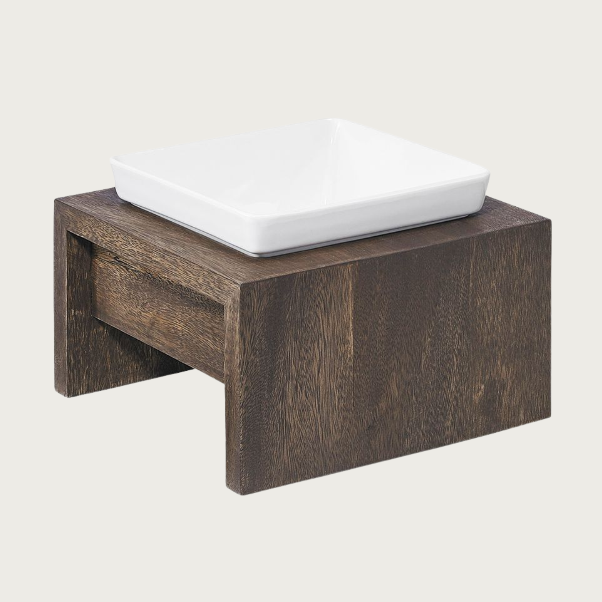 Medium single bowl, elevated dog feeder. Stand is a rich dark brown wood, in a simple square design. Square white ceramic bowl in center.