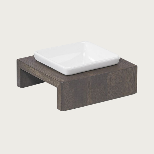 XS single bowl, elevated dog feeder. Stand is a rich dark brown wood, in a simple square design. Square white ceramic bowl in center.
