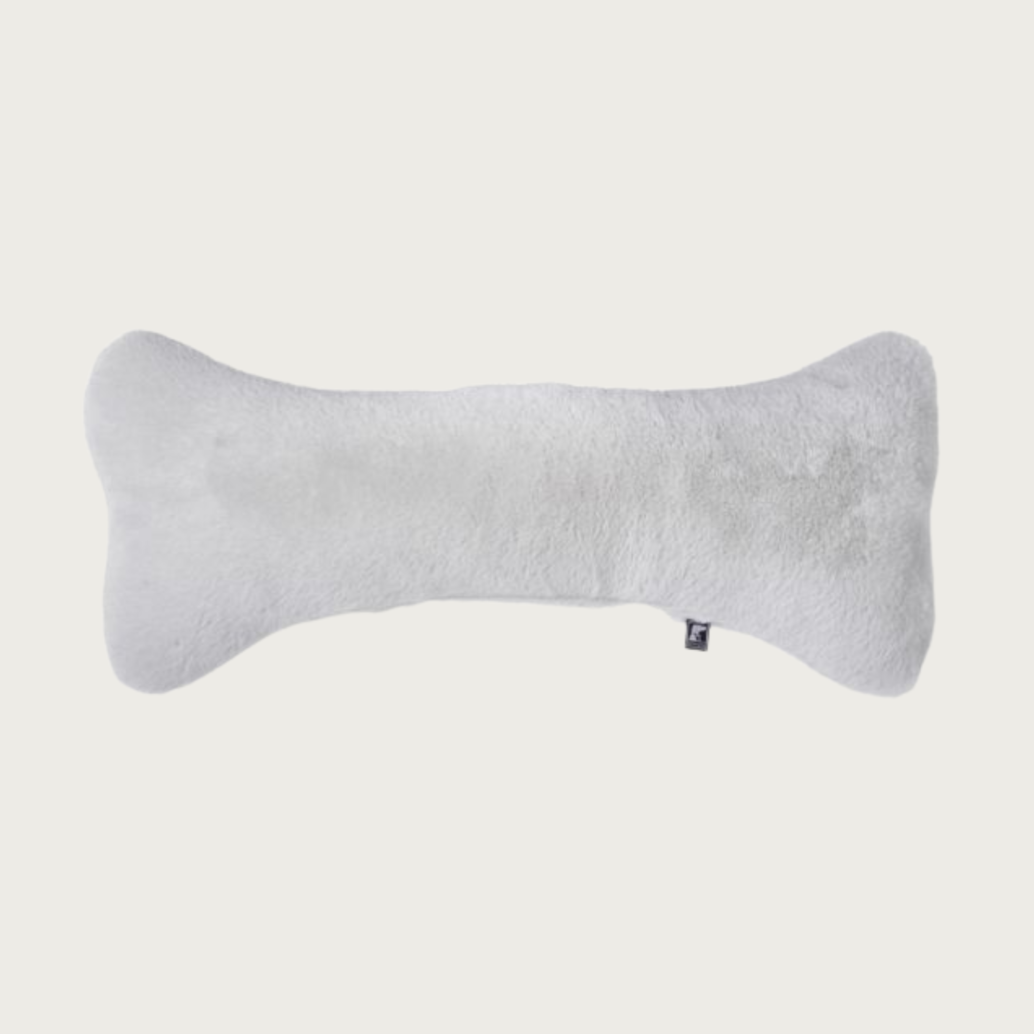 Light gray, bone-shaped plush dog pillow.