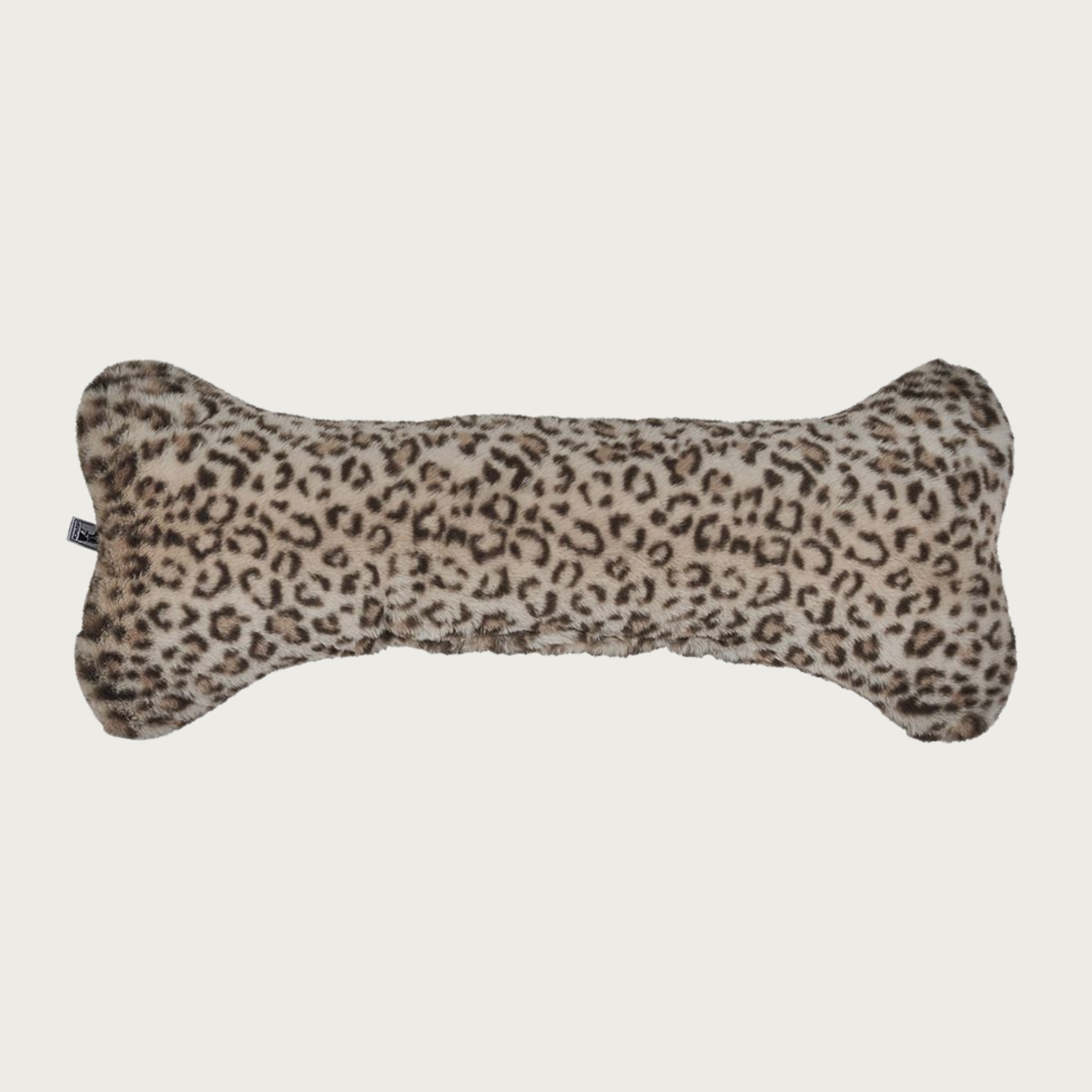 Leopard print, bone-shaped plush dog pillow, in shades of dark brown & beige.