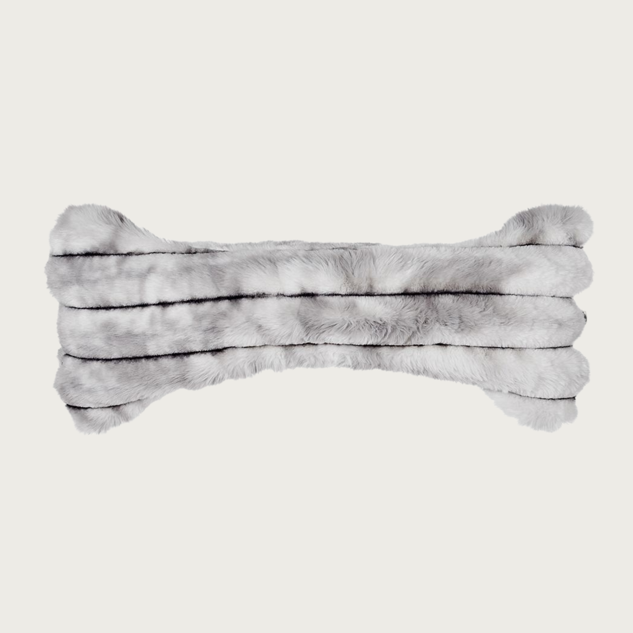 Bone-shaped plush dog pillow in muddled gray & white tones. It features a horizontal ridged texture.