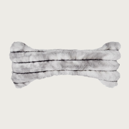 Bone-shaped plush dog pillow in muddled gray & white tones. It features a horizontal ridged texture.