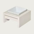 Load image into Gallery viewer, SM/MD Single bowl, elevated dog feeder. Stand is a creamy white color, in a simple square design. Square white ceramic bowl in center.
