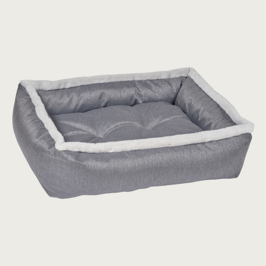 Medium-gray colored, rectangular pet bed with light gray faux fur trim on top edges. 