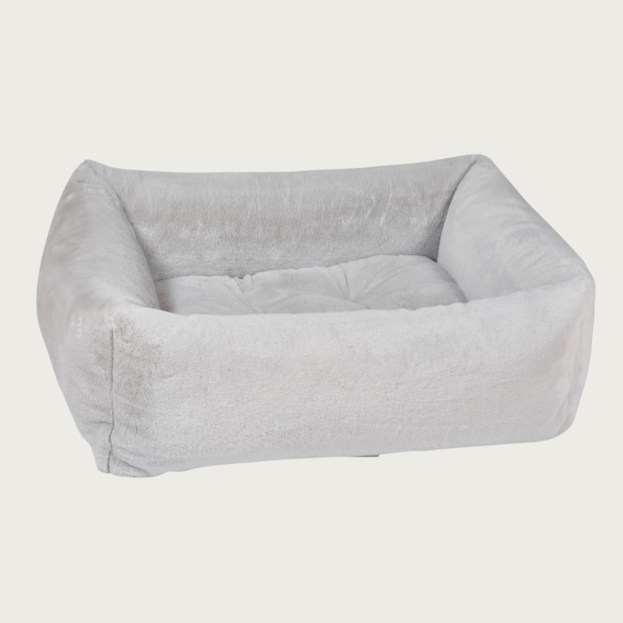 Light gray colored, faux fur plush rectangular pet bed with bolsters & tufted center cushion.