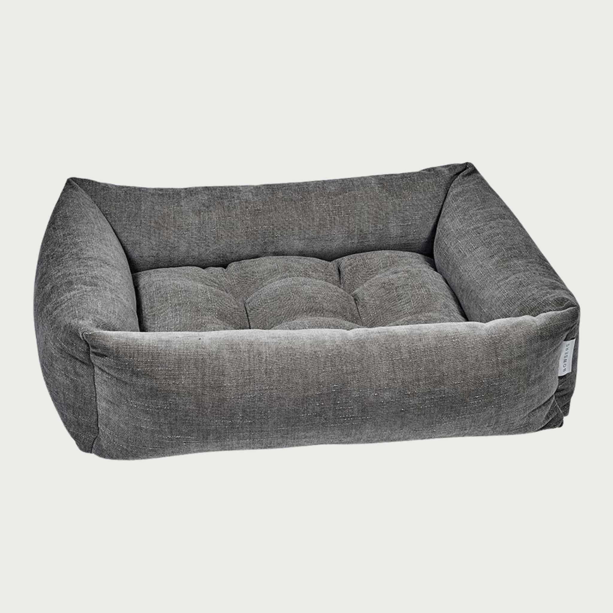 Mousse (medium grayish brown) colored, rectangular pet bed with bolsters & tufted center cushion. It has a slightly textured, stonewashed appearance.