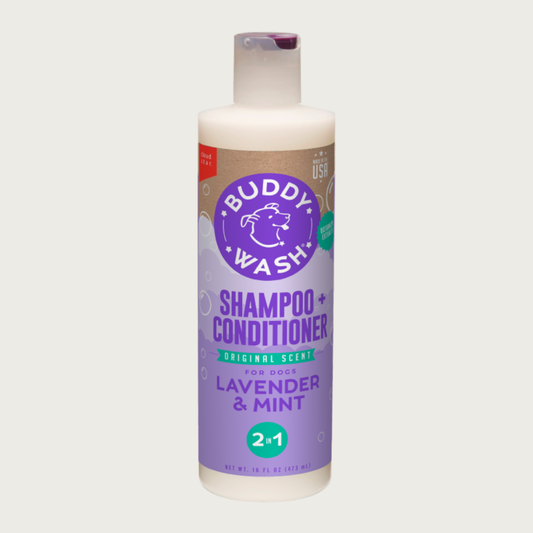 Opaque white plastic bottle of Buddy Wash 2 in 1 shampoo and conditioner for dogs, with flip cap. Original scent; lavender & mint. Net Wt. 16 fl oz. Made in USA.