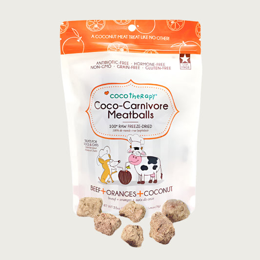 2.5 oz white and orange bag of CocoTherapy Beef + Oranges + Coconut Coco-Carnivore Meatballs treats for dogs & cats. 100% raw freeze-dried.  Made in USA. Sample treats in front of bag are tan, and look like small, uneven shaped nuggets.