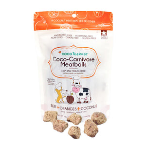 2.5 oz white and orange bag of CocoTherapy Beef + Oranges + Coconut Coco-Carnivore Meatballs treats for dogs & cats. 100% raw freeze-dried.  Made in USA. Sample treats in front of bag are tan, and look like small, uneven shaped nuggets.