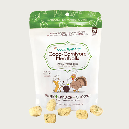 2.5 oz white and green bag of CocoTherapy Turkey + Spinach + Coconut Coco-Carnivore Meatballs treats for dogs & cats. 100% raw freeze-dried.  Made in USA. Sample treats in front of bag are beige, and look like small, uneven shaped nuggets.