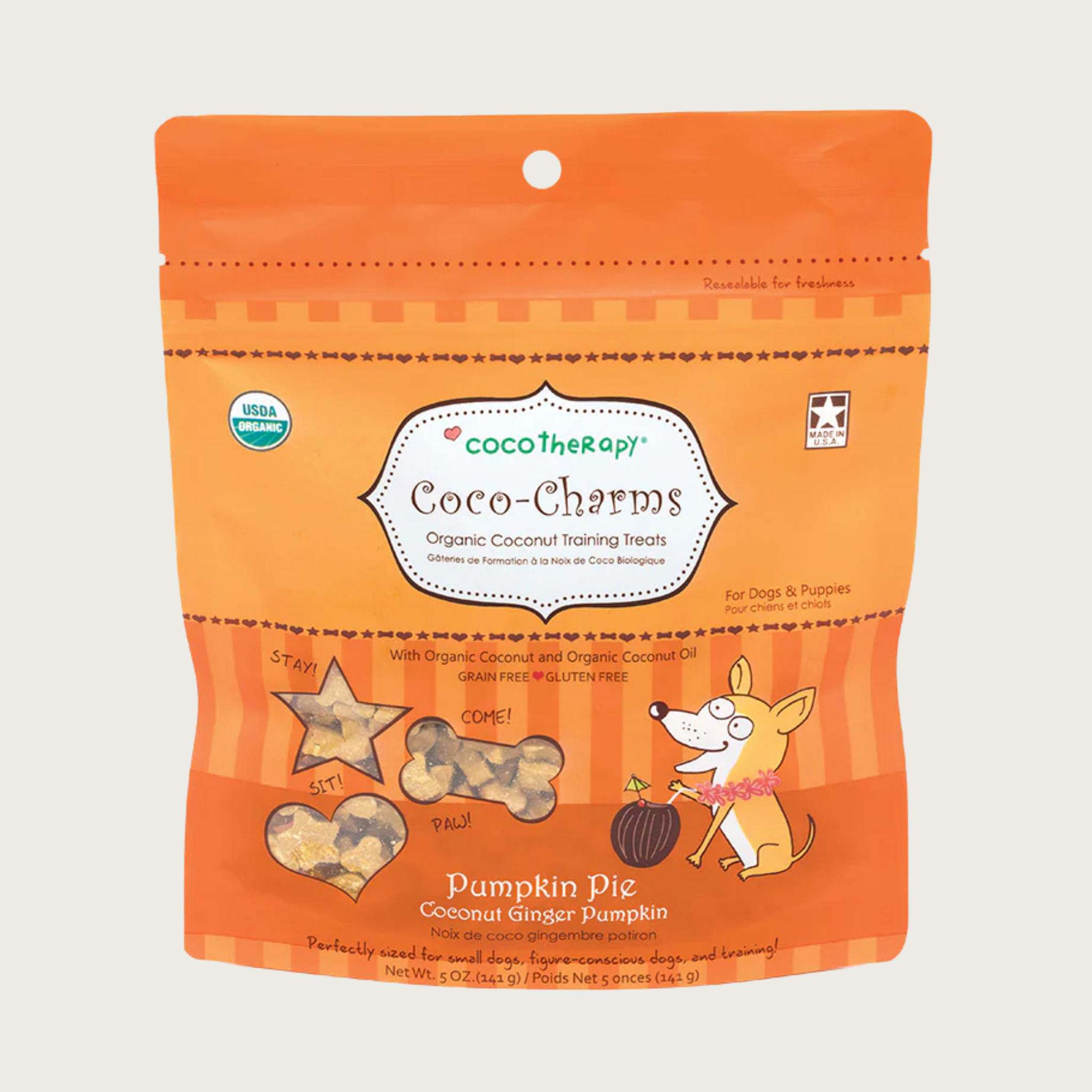 5 oz orange bag of CocoTherapy Coco-Charms Pumpkin Pie organic coconut training treats for dogs. Made with coconut & coconut oil. Grain-free, gluten free. USDA organic, made in USA. Treats visible through 3 clear windows are tiny (smaller than a dime) and tan colored, and in three shapes: hearts, stars and bones.