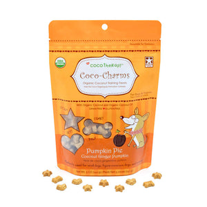 5 oz orange bag of CocoTherapy Coco-Charms Pumpkin Pie organic coconut training treats for dogs. Made with coconut & coconut oil. Grain-free, gluten free. USDA organic, made in USA. Sample of treats in front of bag are tiny (smaller than a dime) and tan colored, and in three shapes: hearts, stars and bones.