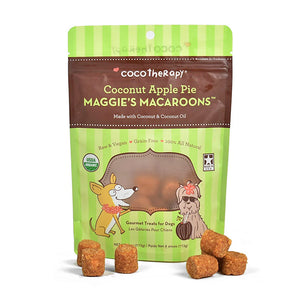 4 oz green and brown bag of CocoTherapy Coconut Apple Pie Maggie's Macaroons gourmet treats for dogs. Made with coconut & coconut oil. Raw & vegan, grain-free, 100% all natural. USDA organic, made in USA. Sample treats in front of bag are brown, and look like tater tots.