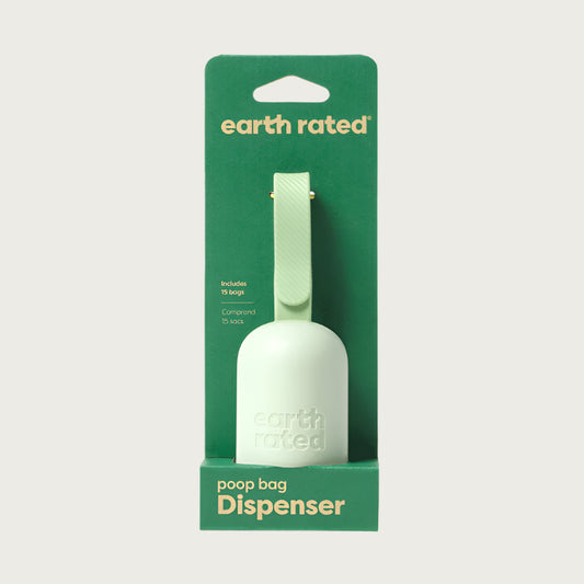 Poop Bag Dispenser in green cardboard packaging. 