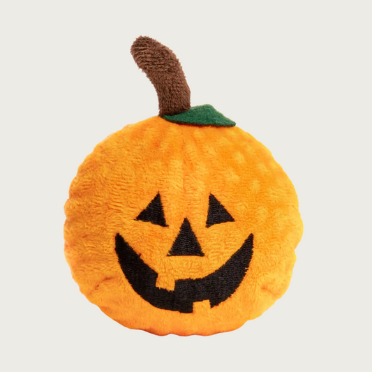 Plush pumpkin dog toy with an embroidered jack o'lantern style smiling face.