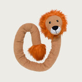 View of this toy in a coil, not knotted. Tan, snake-like dog toy with a lion head with bright orange furry mane and cute face. Tail end of the toy has a large tuft of bright orange furry fluff. 