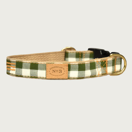 Olive green and cream gingham checkered dog collar with a black plastic buckle and brass D-ring.