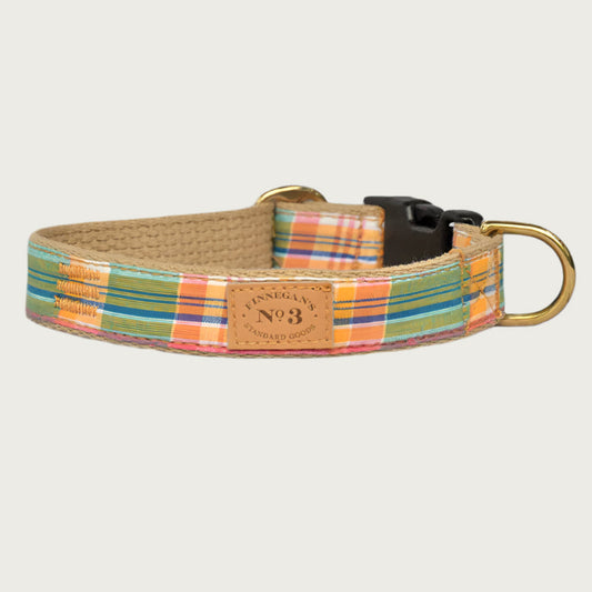 Plaid dog collar in light shades of green, coral, pink, yellow and blue. Black plastic buckle and brass D-ring.