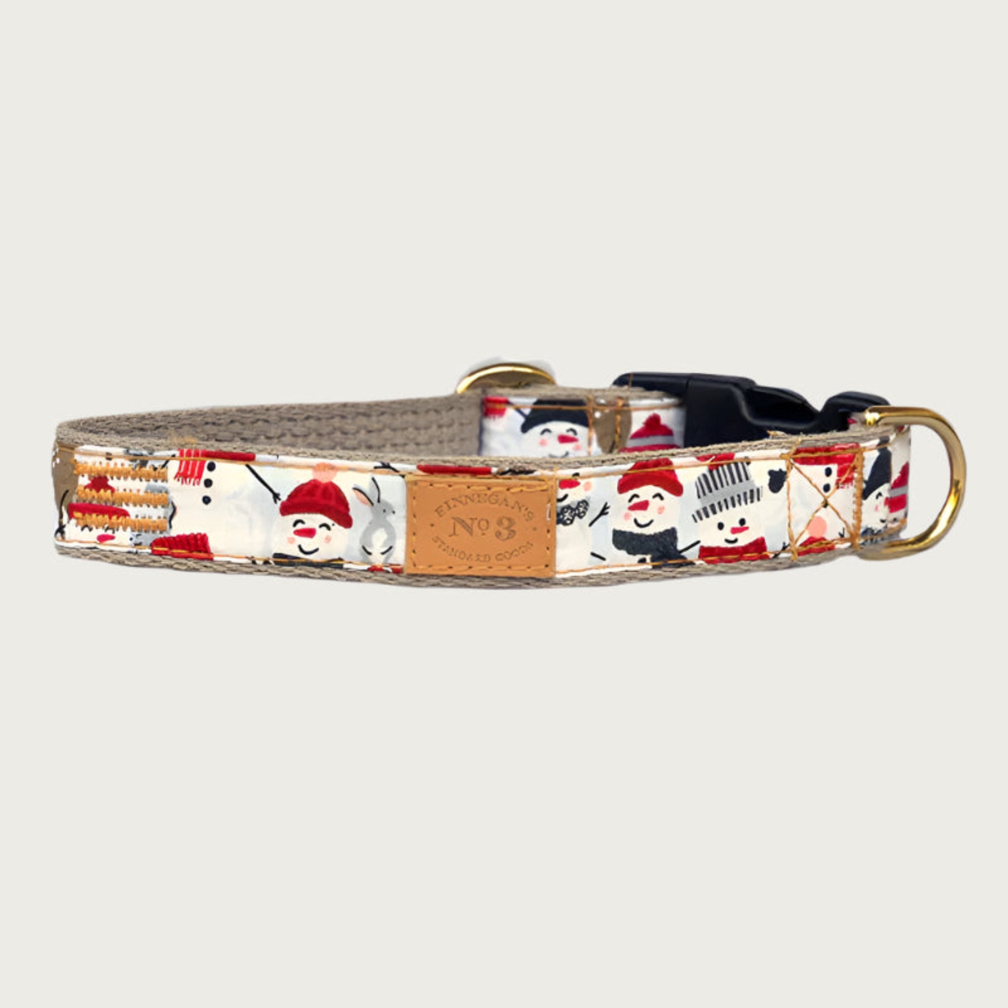 Dog collar with snowman pattern; each is wearing snow hats and scarves in different shades of red, black and gray.