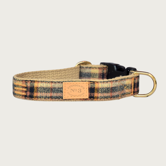 Plaid dog collar in muted shades of black, tan and orange.