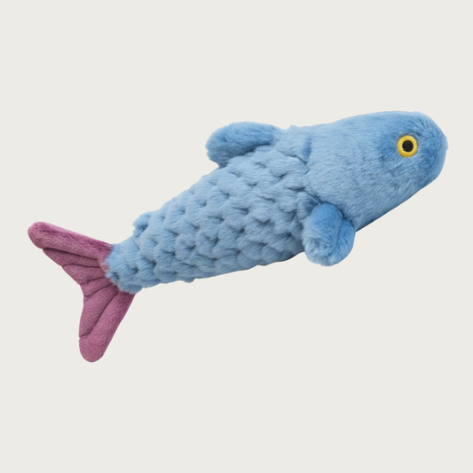 A plush fish-shaped dog toy in light blue with a textured scale pattern, medium purple tail, and embroidered yellow & black eyes.