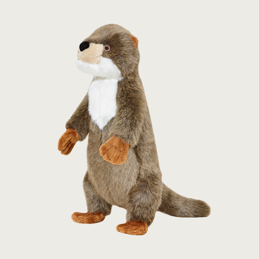 A plush otter dog toy standing upright, with brown faux fur and a white chest, embroidered eyes & black nose, with tan paws and tiny ears.