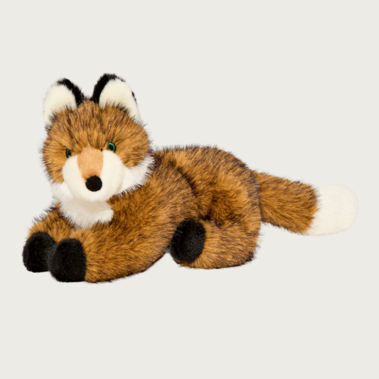 Plush fox dog toy, laying on its stomach with outstretched front legs. It is covered in fluffy, faux fur brown plush with black on tips to look more like real fox fur. Its chest, snout, ears and tail are accented with cream faux fur plush.