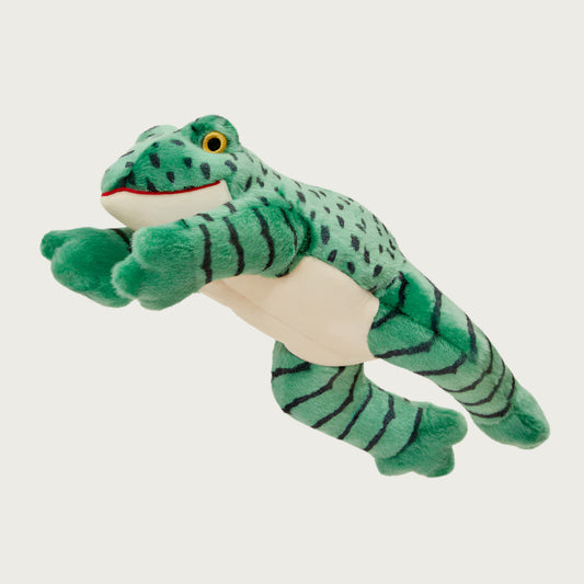 Plush Oliver Frog dog toy from Fluff & Tuff. Toy is mid-leap with legs extended, and has a green body and legs with ivory chin and belly. Its head and back have black dots and its legs have black stripes. It has yellow and black eyes.