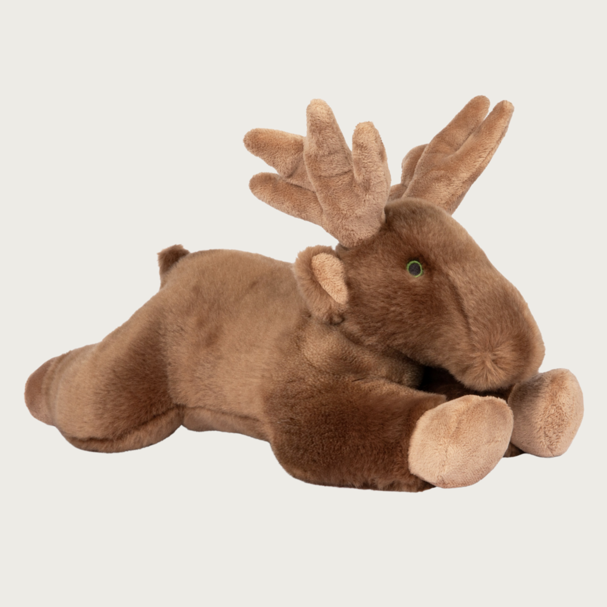 A brown plush moose dog toy lying down on its tummy with its front & back legs extended, large light brown antlers, and embroidered black & green eyes.