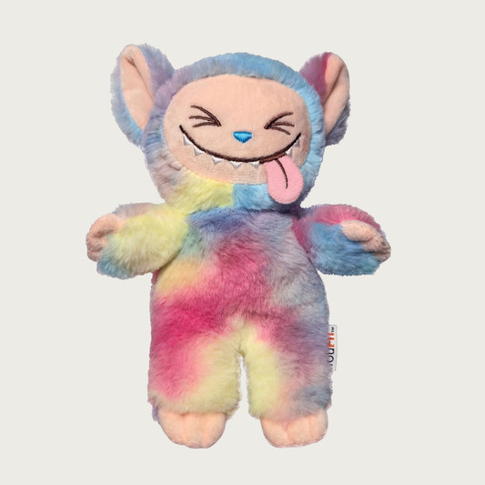 Plush dog toy designed to look like one of the popular Labubu collectible toys. It has a wide toothy grin with its tongue sticking out, and features bright shades of pink, blue, yellow, and other tie-dyed pastel colors.