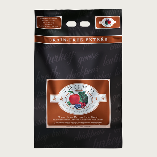 A 12 pound black and brown bag of Fromm Game Bird Recipe dog food. The banner on top of the bag reads "Grain-Free Entree".