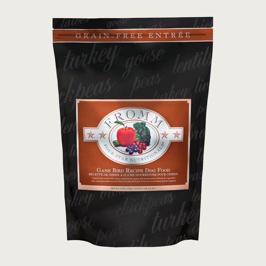 A 4 pound black and brown bag of Fromm Game Bird Recipe dog food. The banner on top of the bag reads "Grain-Free Entree".