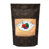A 4 pound black and tan bag of Fromm Pork & Applesauce Recipe dog food.
