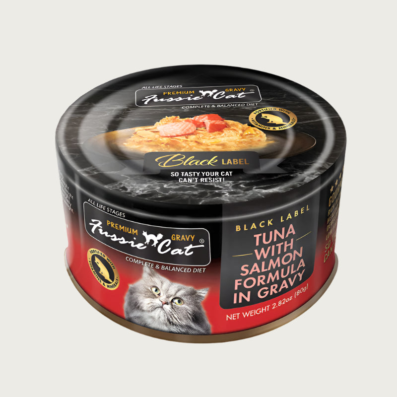 2.82 oz black & red can of Fussie Cat Black Label Tuna with Salmon Formula in Gravy. Complete and balanced diet for all life stages. Fortified with vitamins and minerals. So tasty your cat can't resist! Small photo on top of can shows product inside - flakes of tuna and salmon in gravy.