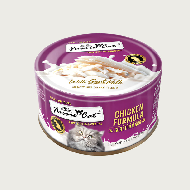A 2.47 oz purple can of Fussie Cat Chicken Formula in Goat Milk Gravy cat food. Super premium, for all life stages - "so tasty your cat can't resist!" Image on top of can shows shredded chicken.
