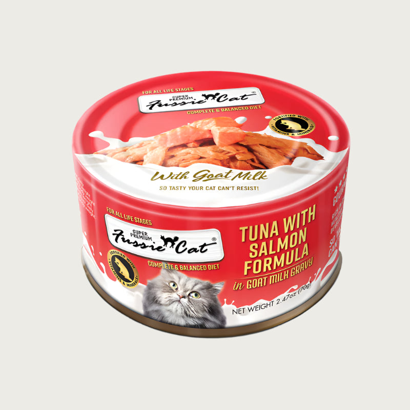 A 2.47 oz red can of Fussie Cat Tuna with Salmon Formula in Goat Milk Gravy cat food. Super premium, for all life stages - "so tasty your cat can't resist!" Image on top of can shows flaked tuna and salmon.